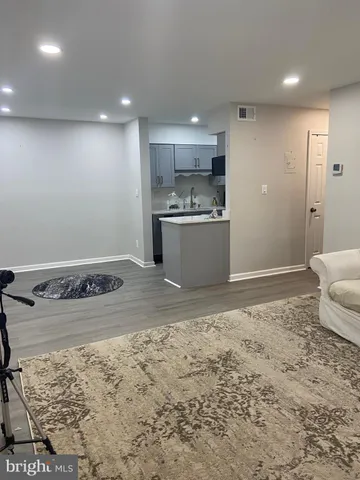 a kitchen with a sink and a refrigerator