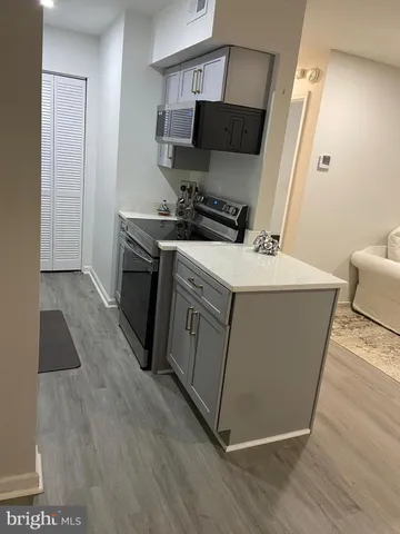 a large bed sitting in a bedroom next to a window