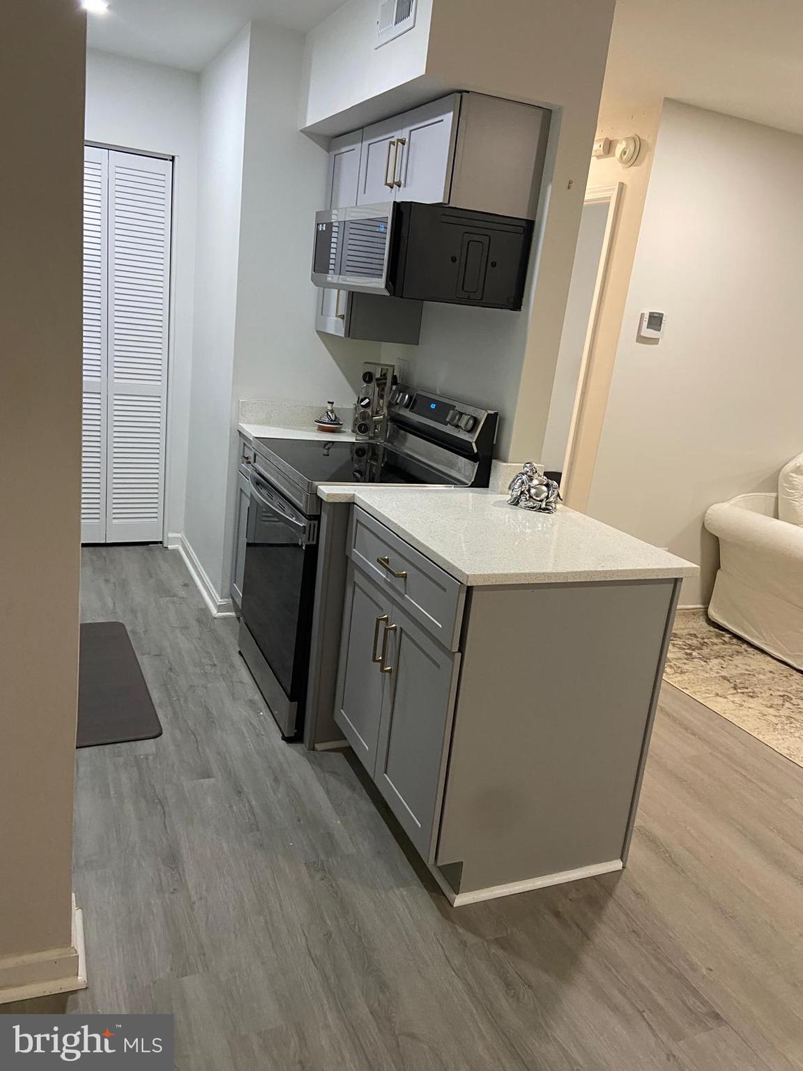 5900 K Surrey Hill Place, Unit 697 Springfield, VA 22152 - Photo 8 of 32 a utility room with washer and dryer