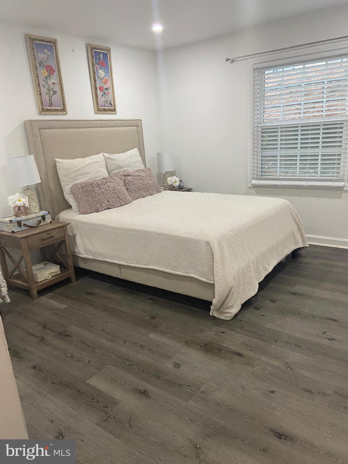 5900 K Surrey Hill Place, Unit 697 Springfield, VA 22152 - Photo 10 of 32 a large bed sitting in a bedroom next to a window