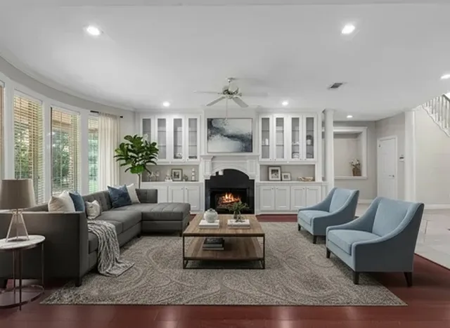 a living room with furniture and a fireplace