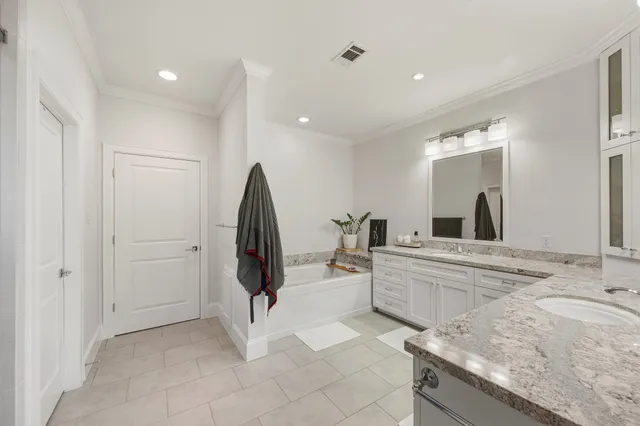 a view of a kitchen with sink and refrigerator