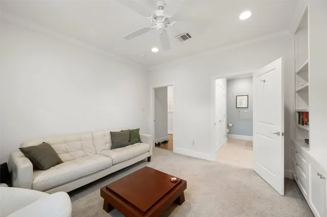 a living room with furniture and a rug