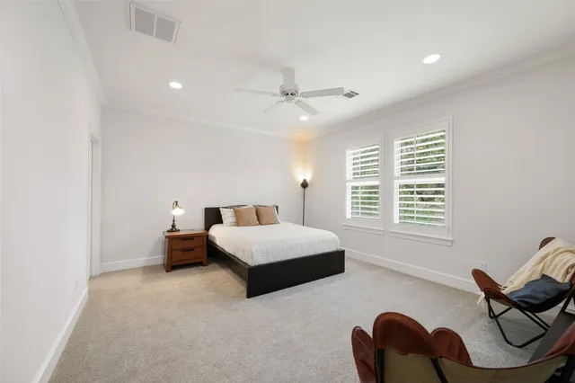 a bedroom with furniture and window