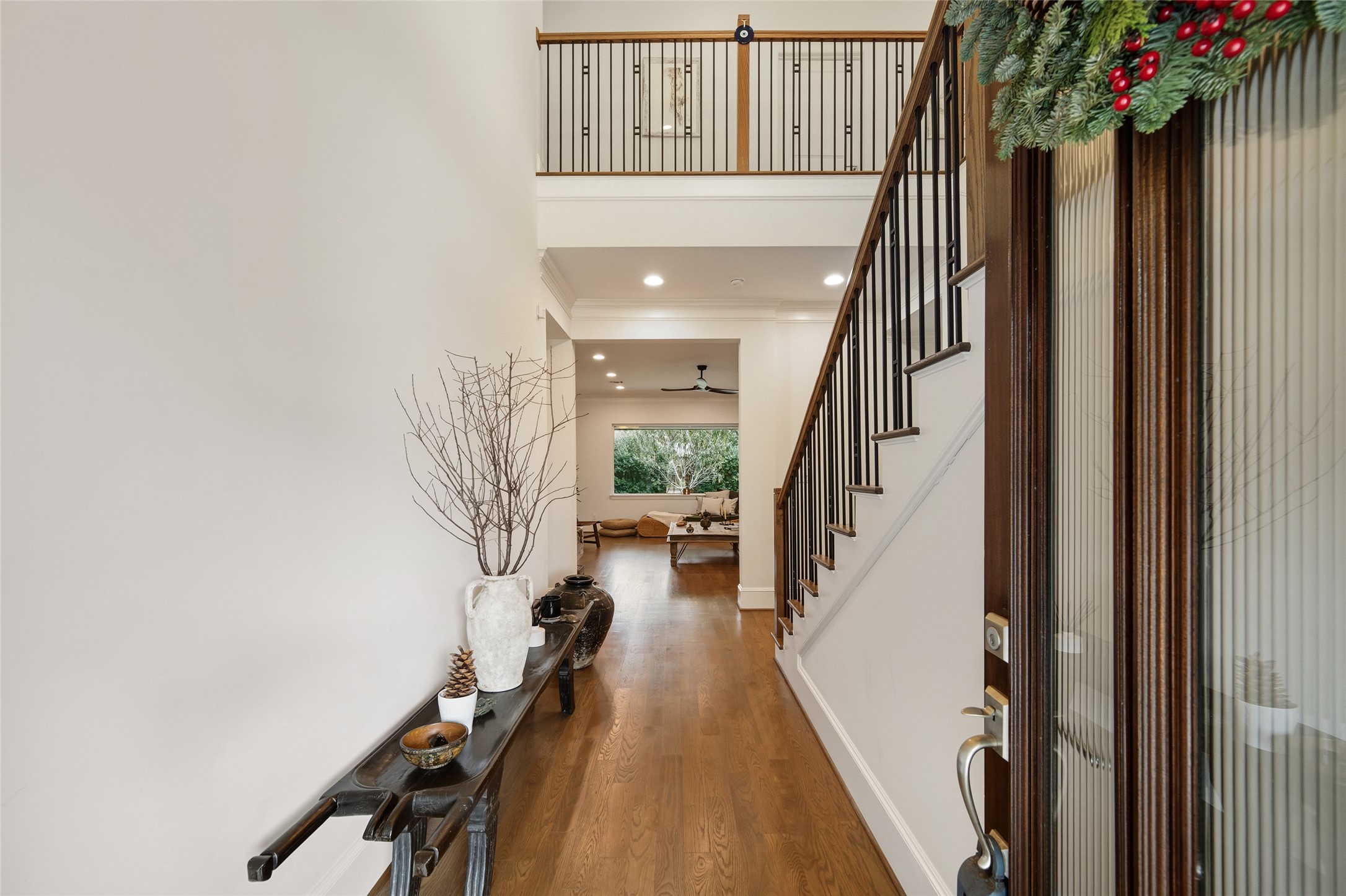 1118 Anderson Street Bellaire, TX 77401 - Photo 4 of 45 a view of staircase with wooden floor and a potted plant