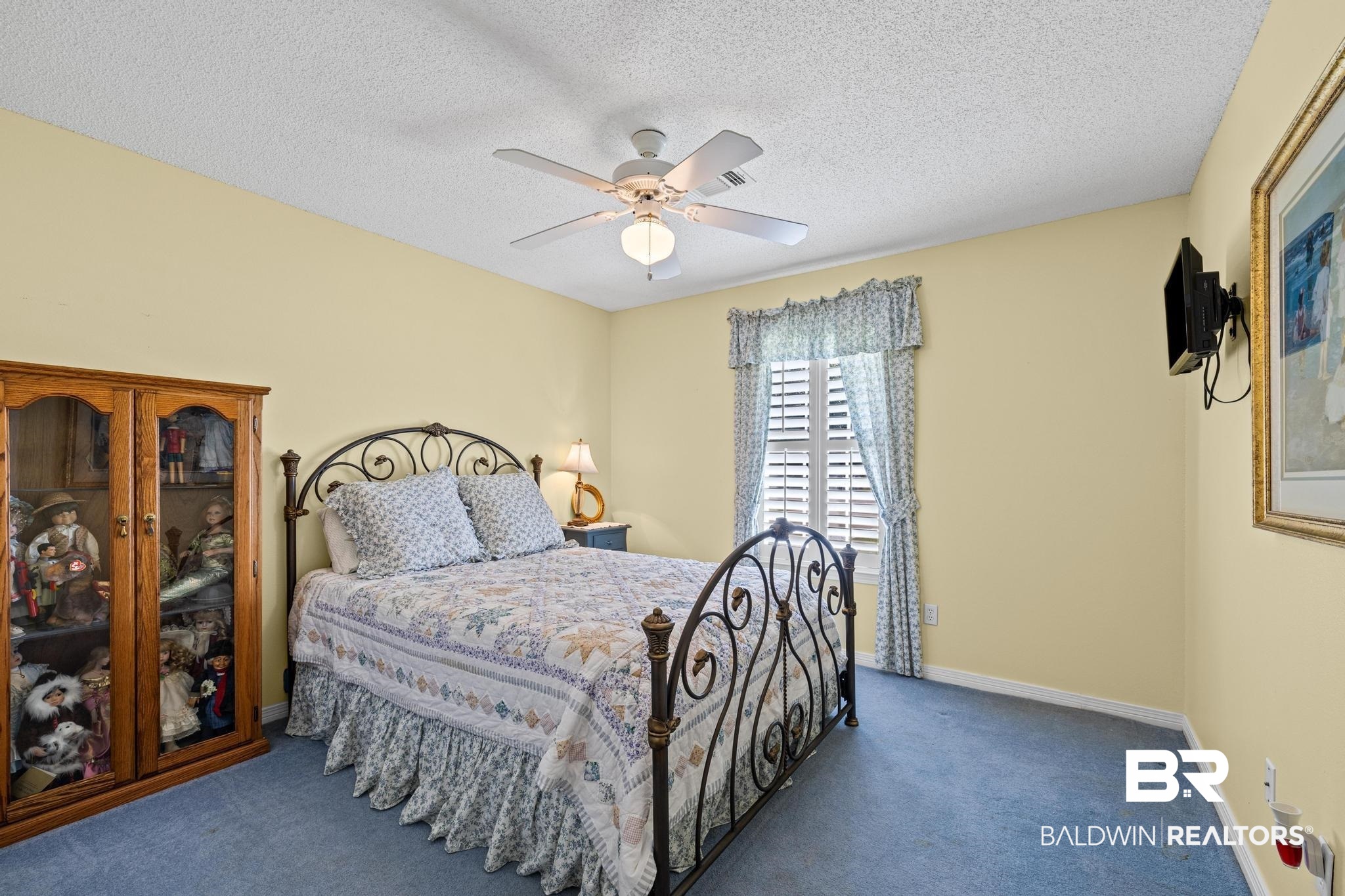 2881 Eslava Circle Lillian, AL 36549 - Photo 20 of 58 Bedroom with a ceiling fan, carpet floors, and a textured ceiling