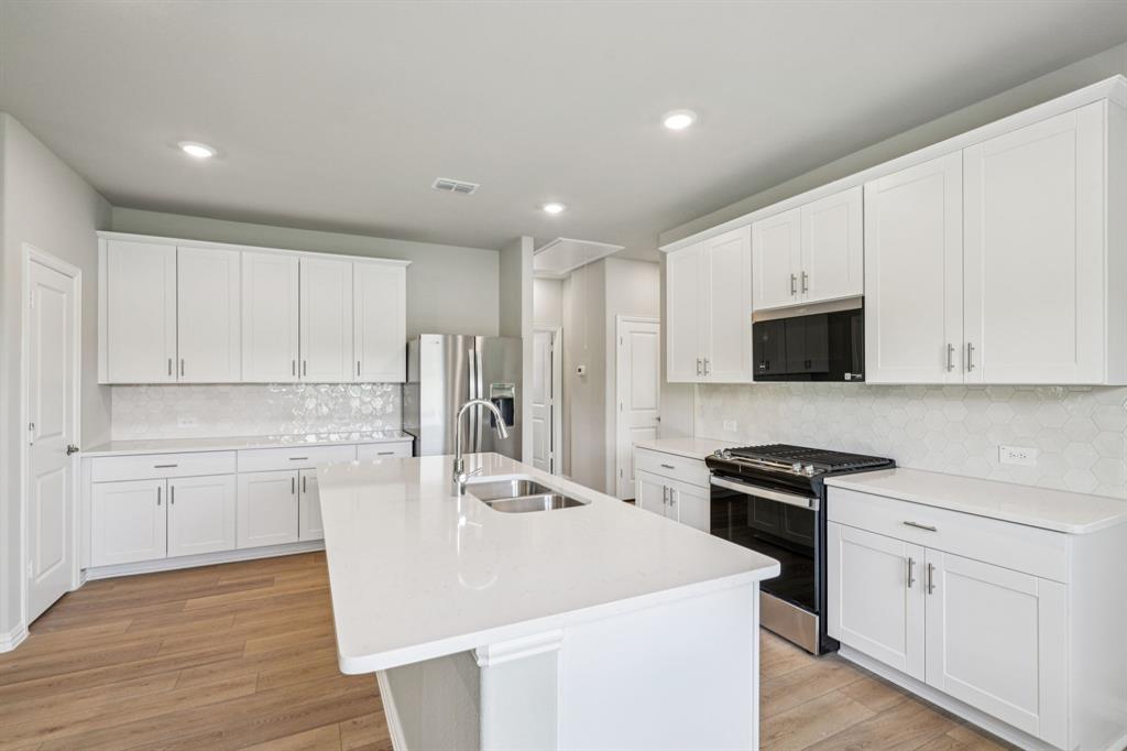 1608 Arches Road Anna, TX 75409 - Photo 4 of 23 Photo is not of the actual home, but is an inspirational photo of builder’s model home and may depict options, furnishings, and/or decorator features that are not included.