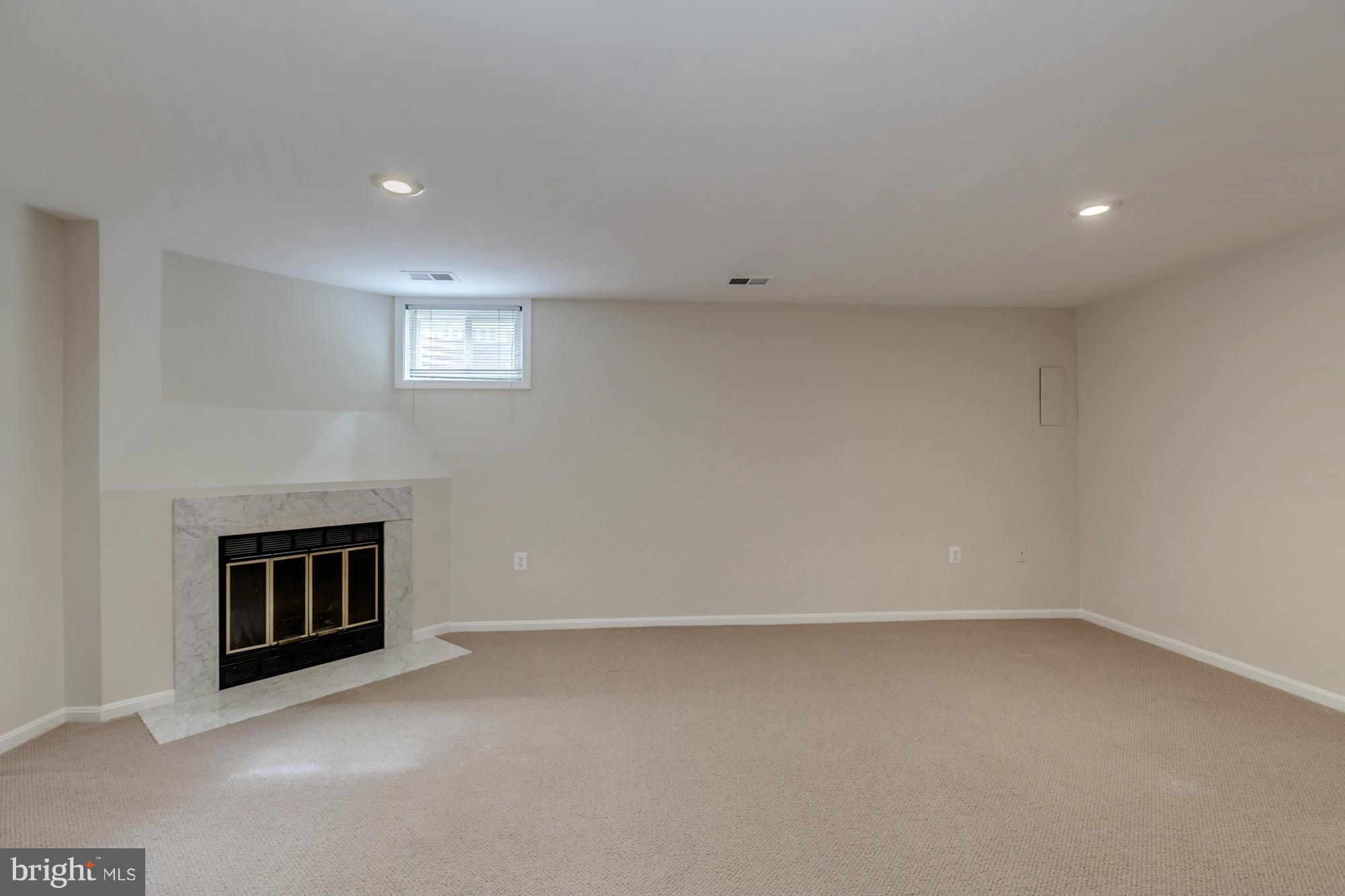 11923 Sentinel Point Court Reston, VA 20191 - Photo 21 of 30 Large Recreation Room w/ Wood Burning Fireplace
