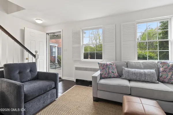 a living room with furniture and a window