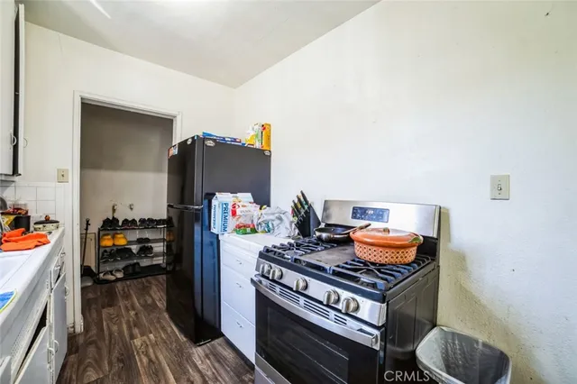 a kitchen with stainless steel appliances granite countertop a stove and a sink