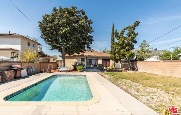 a view of a yard with a patio