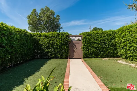 a view of a yard with an outdoor space