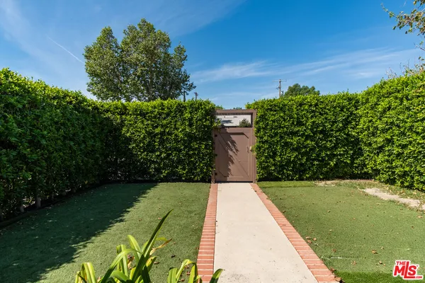 a view of a yard with an outdoor space