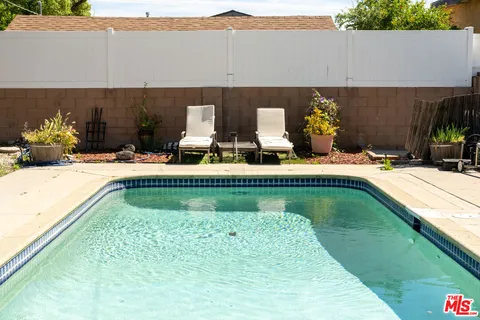 a view of swimming pool from a balcony