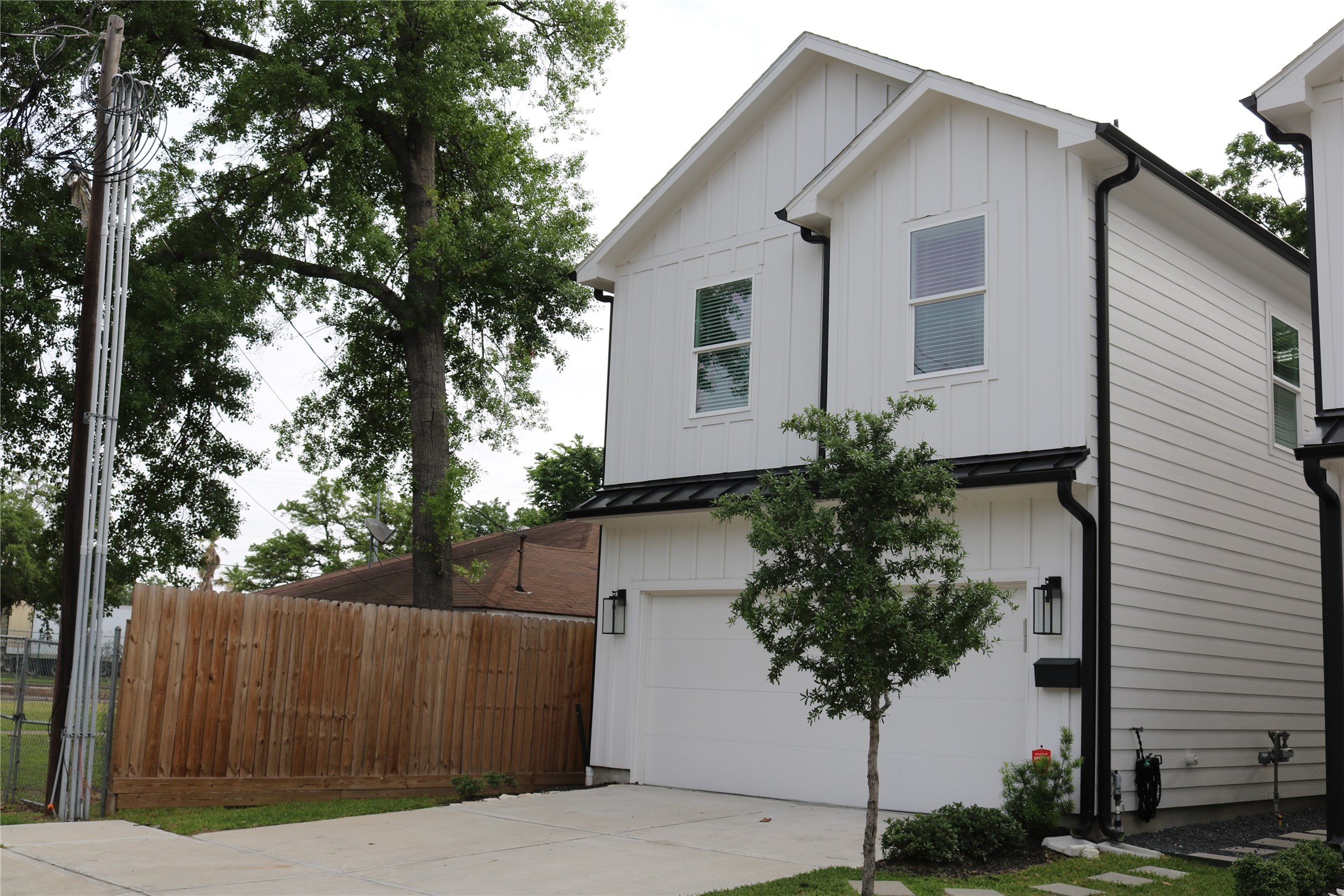 a house that has a tree in front of it
