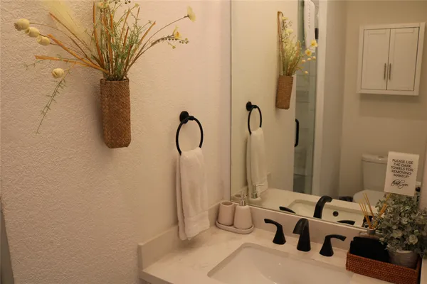 a bathroom with a tub and shower
