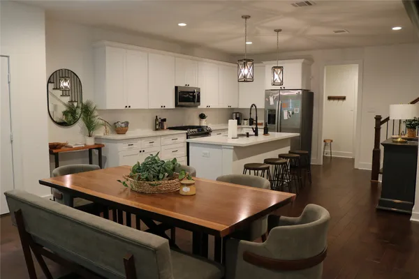 a view of kitchen with dining table and chairs