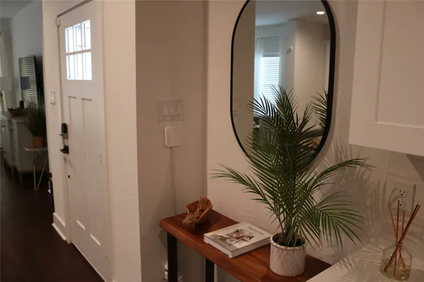 a potted plant sitting in front of a bathroom