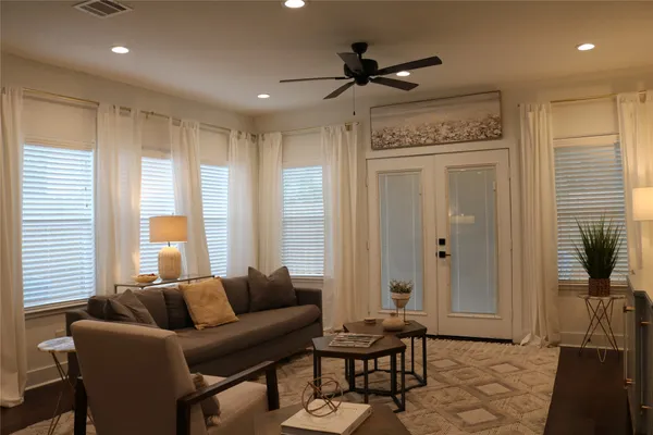 a living room with furniture and a large window