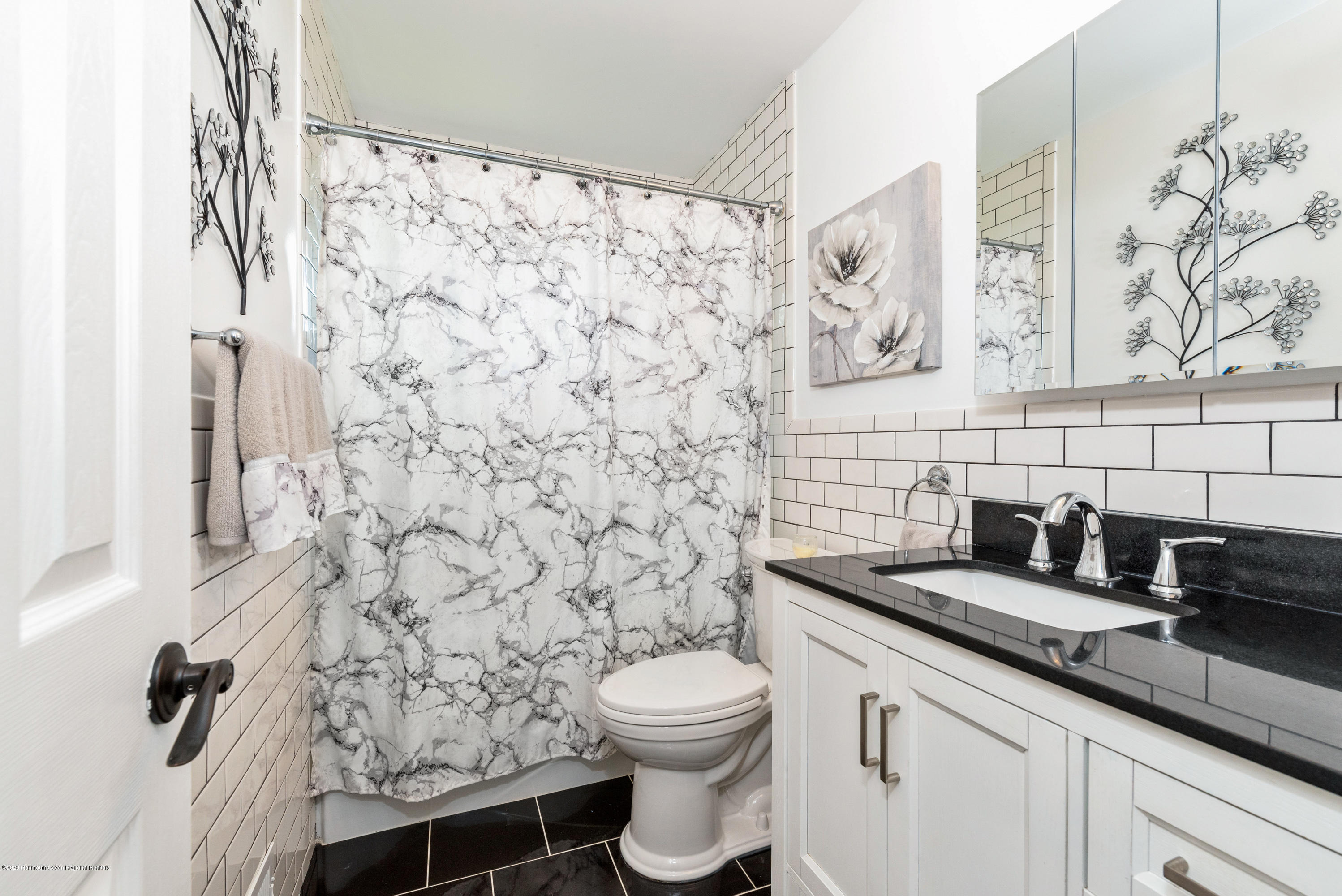 53 Salem Hill Road Howell, NJ 07731 - Photo 15 of 27 a bathroom with a granite countertop sink a toilet and a shower curtain