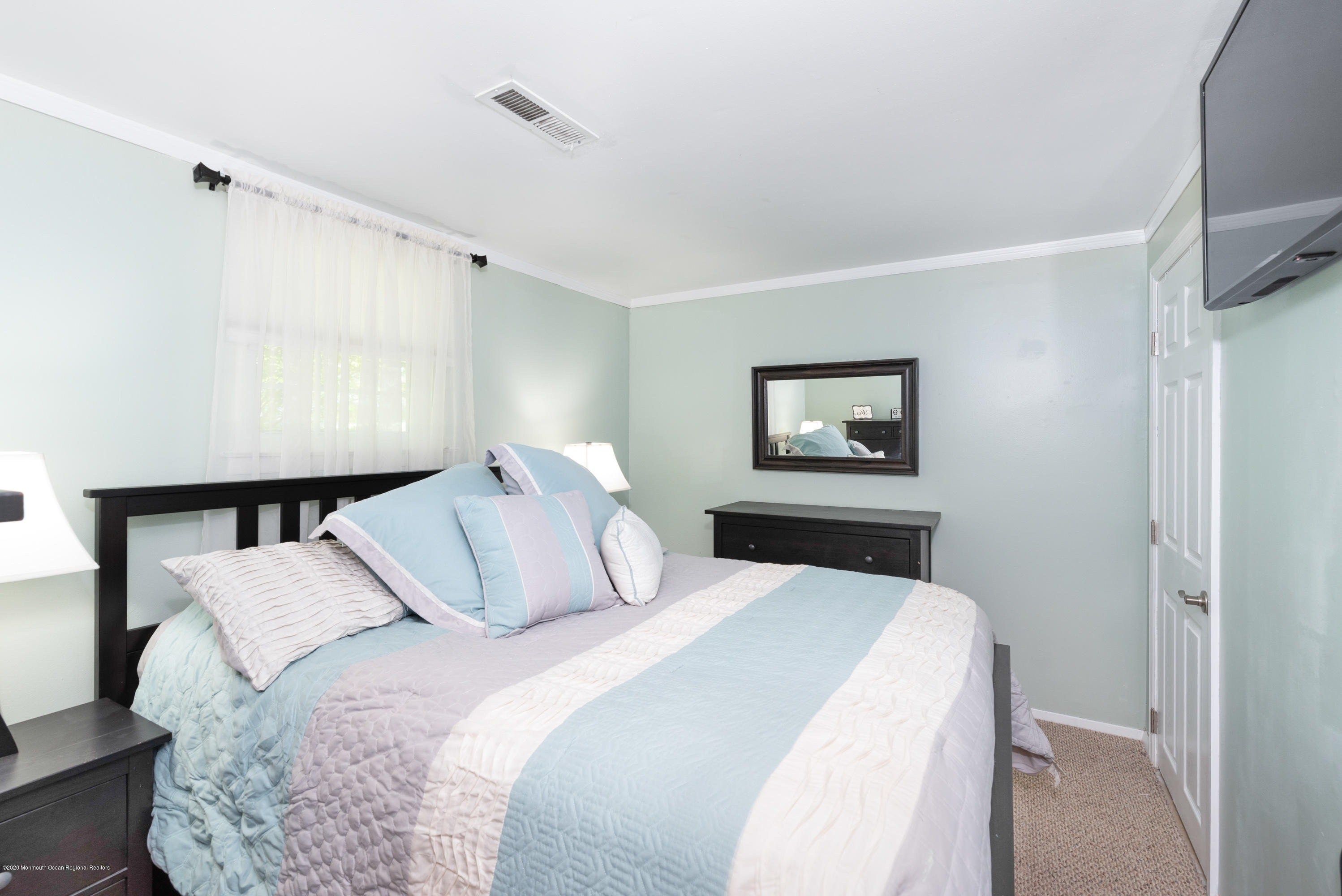 53 Salem Hill Road Howell, NJ 07731 - Photo 20 of 27 a bedroom with a bed and a night stand