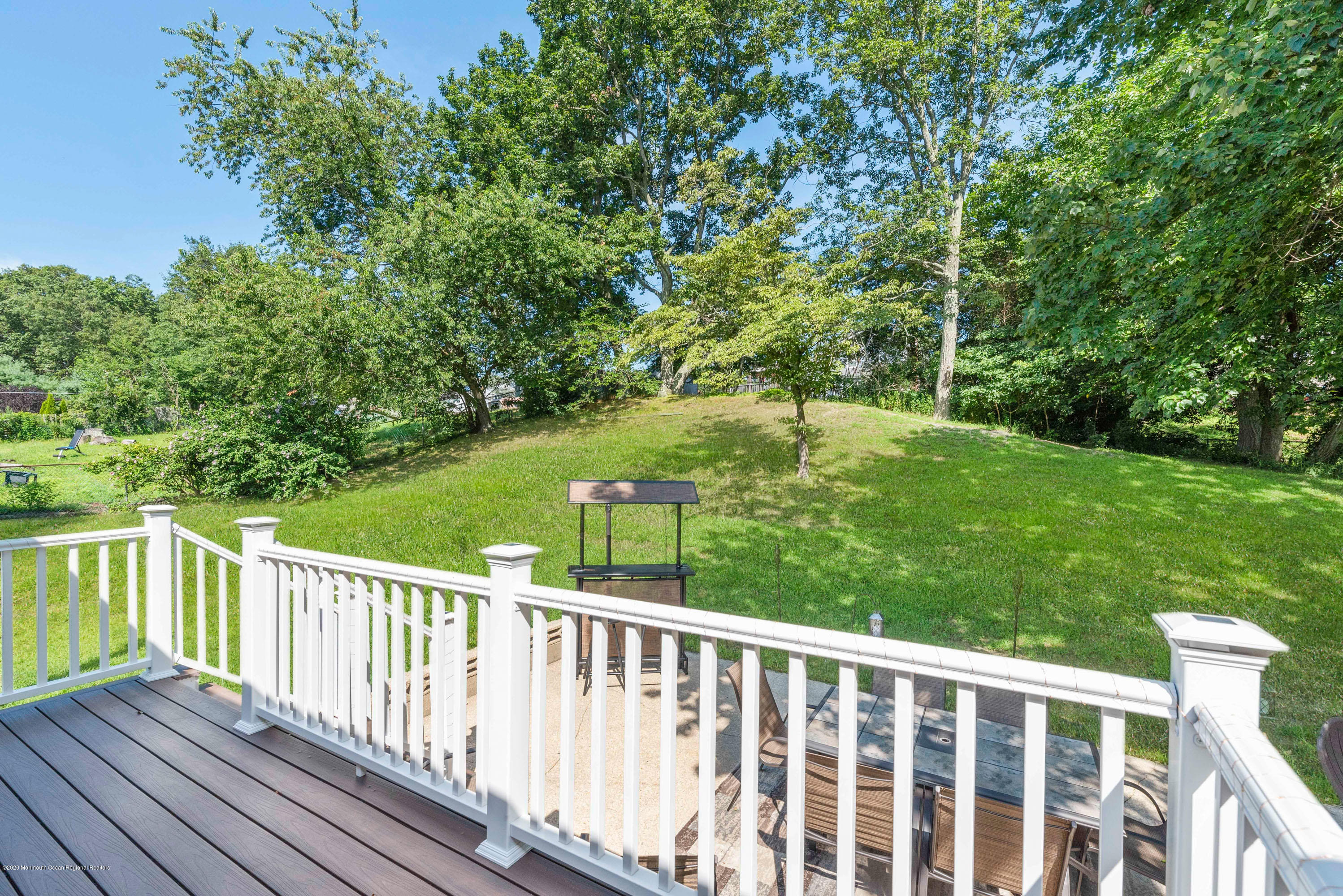 53 Salem Hill Road Howell, NJ 07731 - Photo 22 of 27 a view of a wooden deck next to a yard