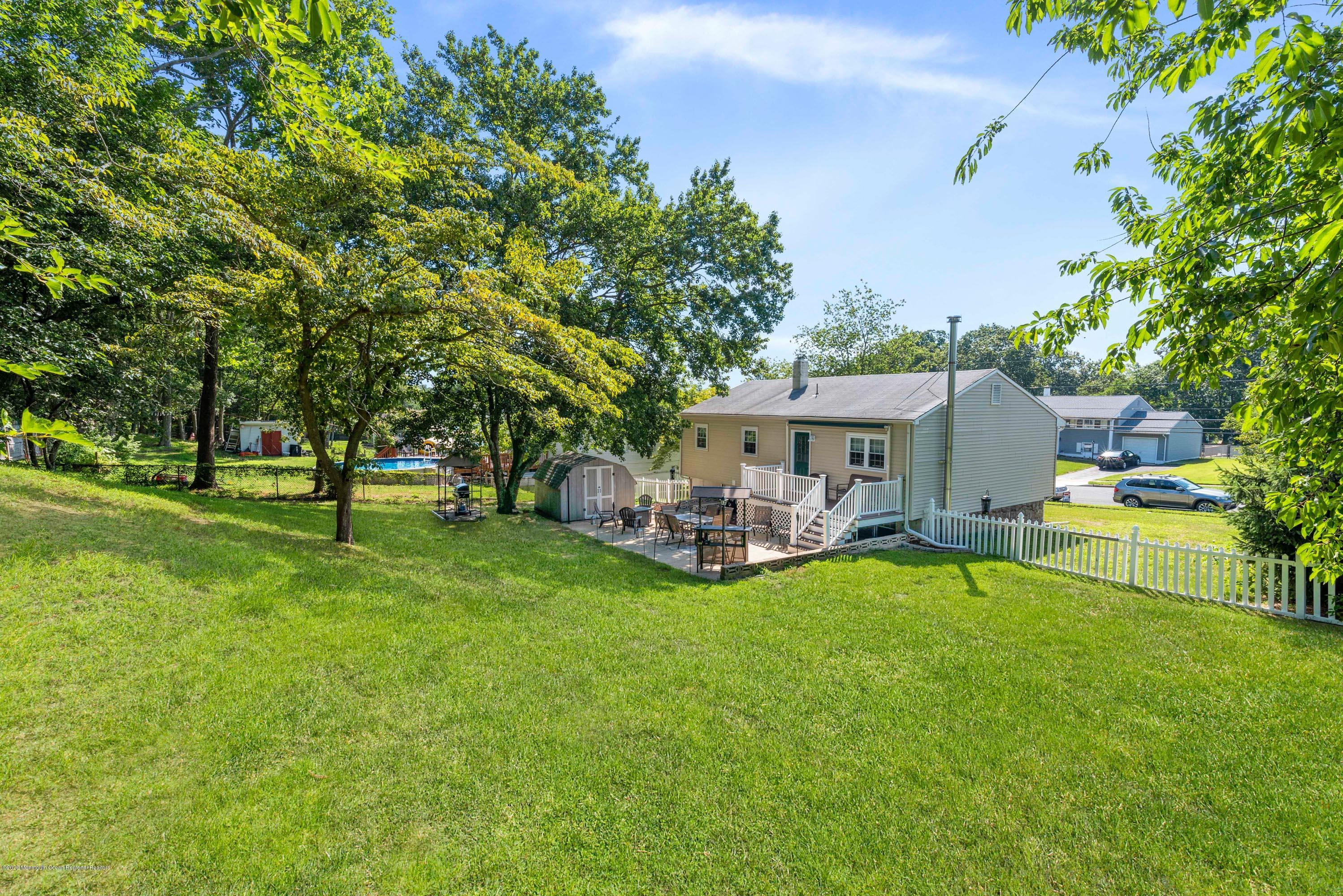 53 Salem Hill Road Howell, NJ 07731 - Photo 24 of 27 a view of a house with swimming pool and sitting area