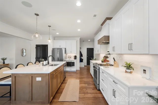 a bathroom with a double vanity sink mirror and