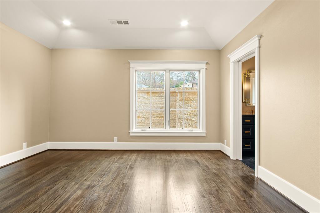 5230 Homer Street Dallas, TX 75206 - Photo 15 of 39 an empty room with wooden floor and windows