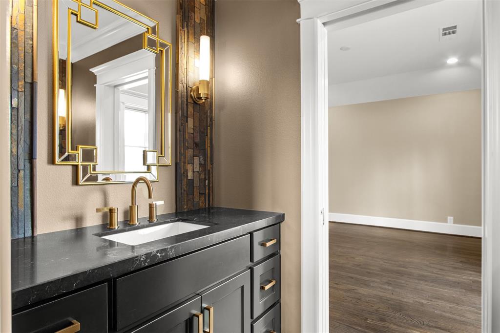 5230 Homer Street Dallas, TX 75206 - Photo 19 of 39 a bathroom with a sink and a mirror