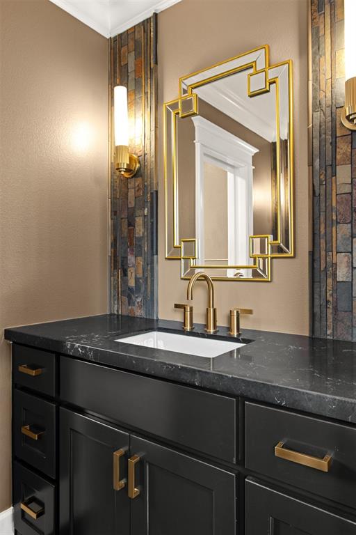 5230 Homer Street Dallas, TX 75206 - Photo 20 of 39 a bathroom with a sink and a mirror