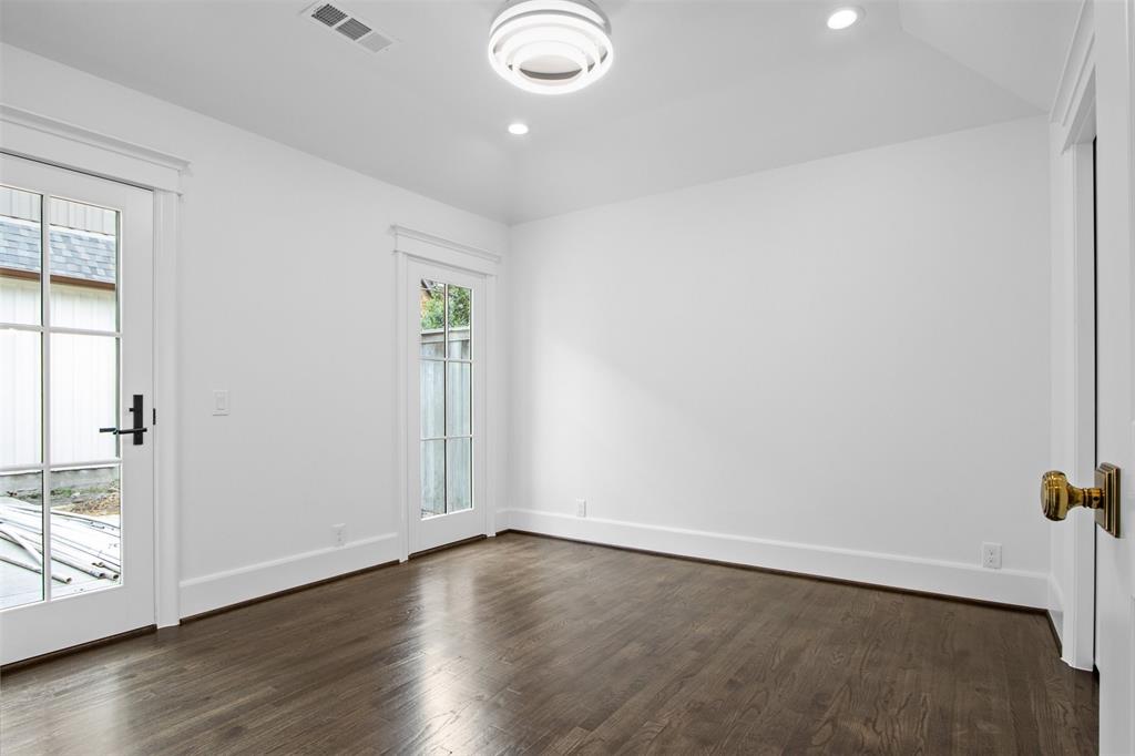 5230 Homer Street Dallas, TX 75206 - Photo 24 of 39 an empty room with wooden floor and windows
