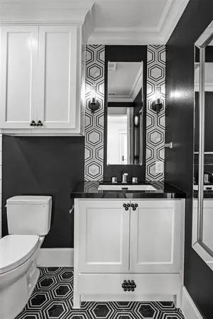 a bathroom with a sink a toilet and bathtub