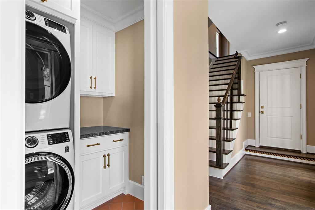 5230 Homer Street Dallas, TX 75206 - Photo 29 of 39 a view of walk in closet with clothes and shoes