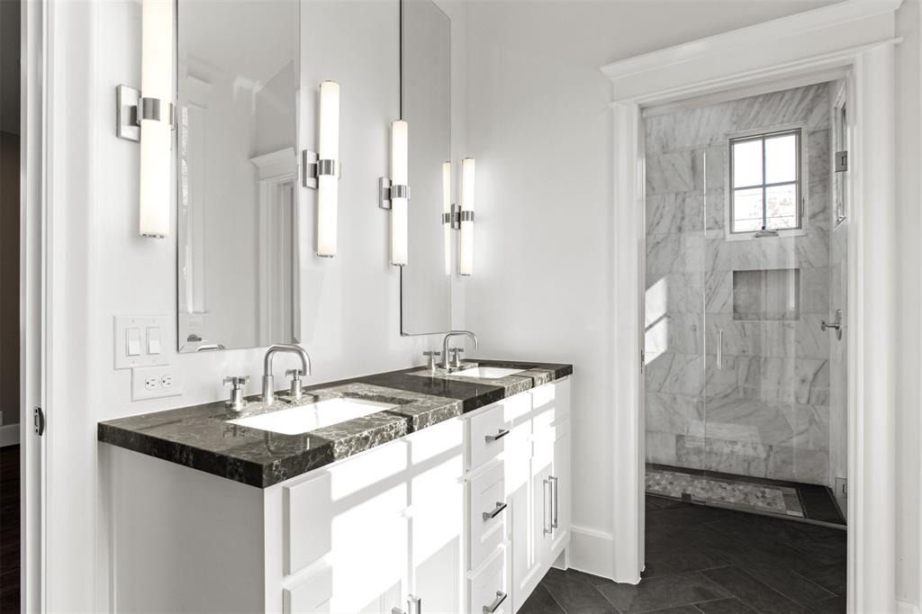 5230 Homer Street Dallas, TX 75206 - Photo 33 of 39 a bathroom with a sink and a mirror