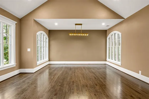 a view of an entryway with wooden floor
