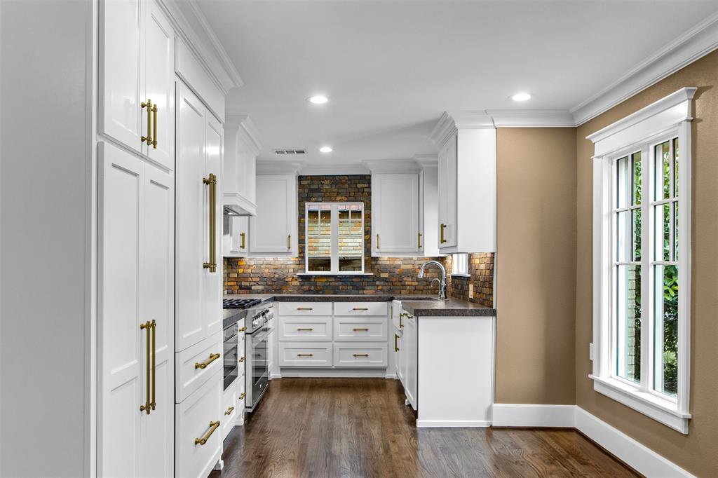 5230 Homer Street Dallas, TX 75206 - Photo 5 of 39 a kitchen with stainless steel appliances a stove and cabinets