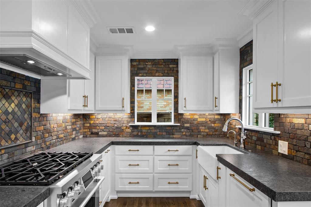 5230 Homer Street Dallas, TX 75206 - Photo 7 of 39 a kitchen with granite countertop a sink stove and cabinets