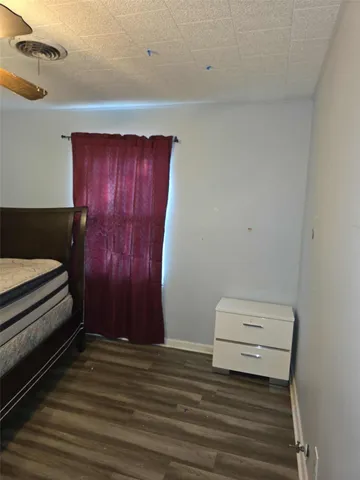 a view of room with wooden floor