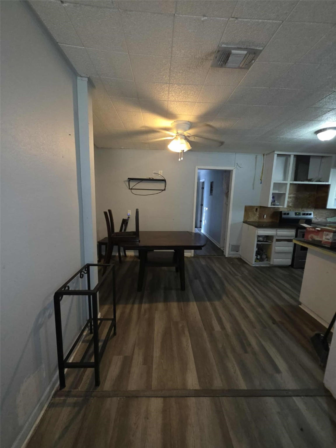 115 Bell Street Point Comfort, TX 77978 - Photo 19 of 24 a living room with furniture a flat screen tv and kitchen view