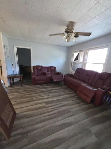 a bedroom with furniture and window