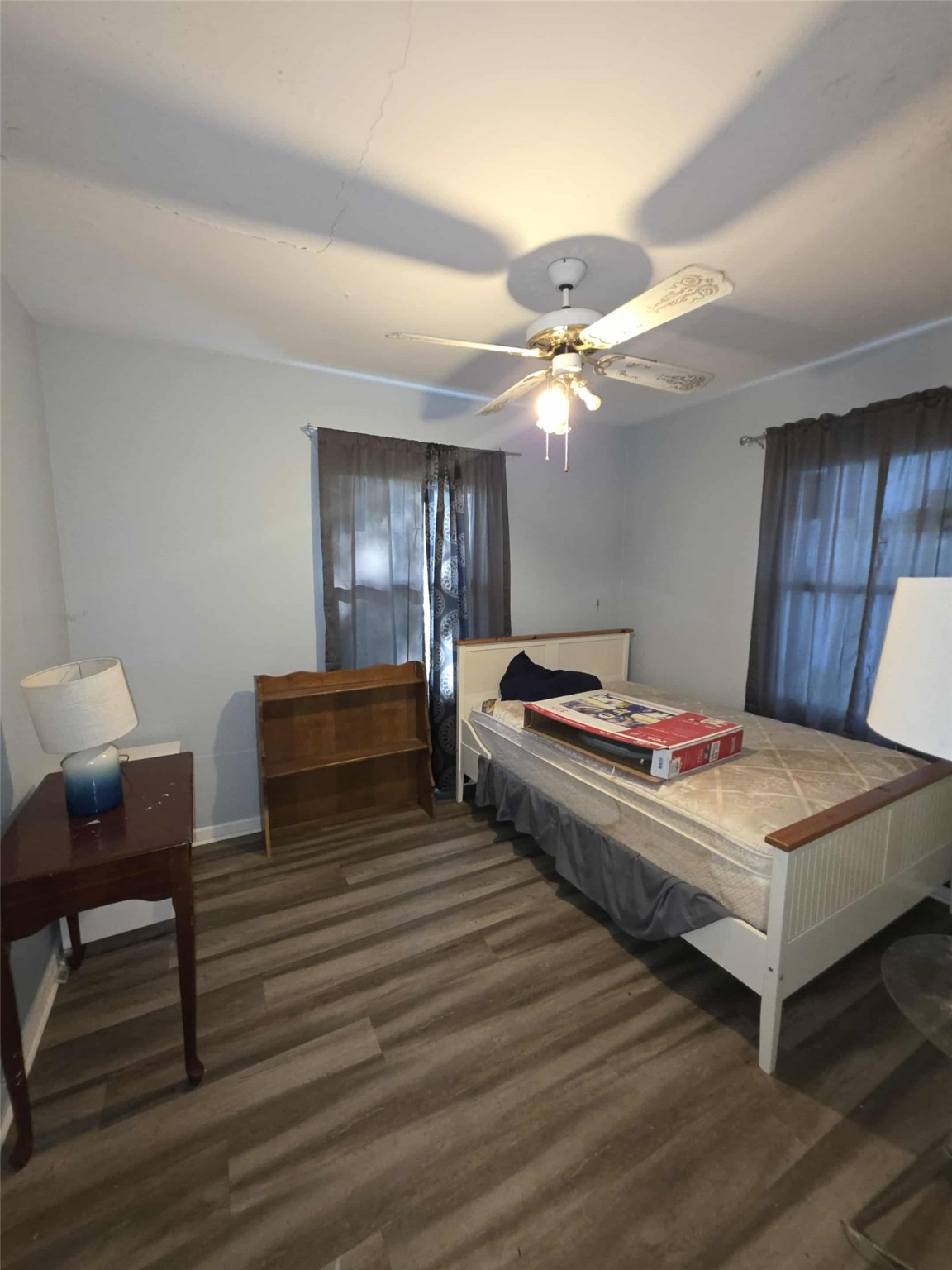 115 Bell Street Point Comfort, TX 77978 - Photo 10 of 24 a bedroom with bed and a chandelier