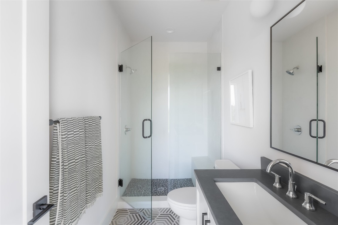 7809 Old Bee Caves Road, Unit 13 Austin, TX 78735 - Photo 13 of 30 a bathroom with a sink and a mirror