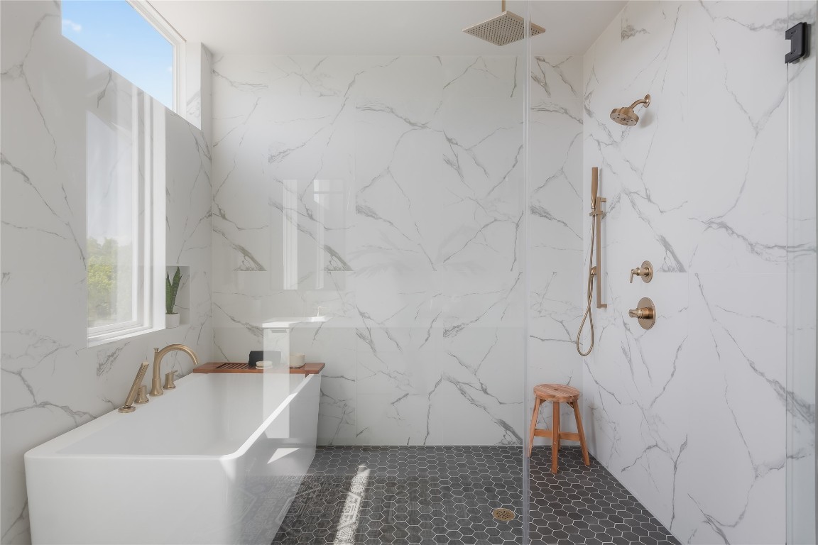 7809 Old Bee Caves Road, Unit 13 Austin, TX 78735 - Photo 17 of 30 a bathroom with a sink and bathtub with shower