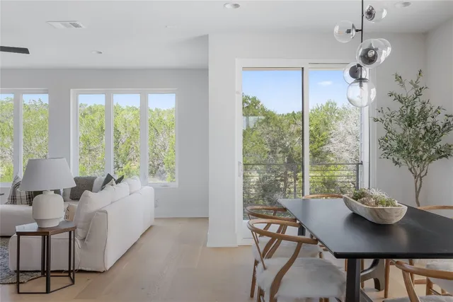 a view of a dining room with furniture window and outside view