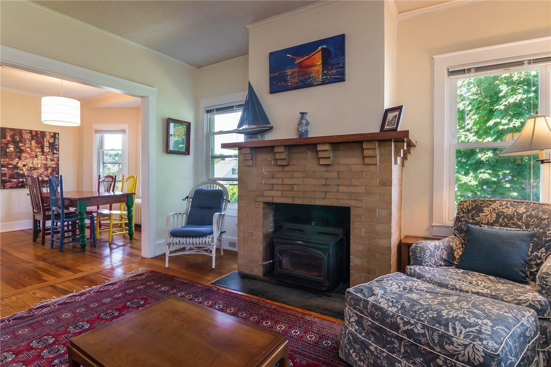 167 Bliss Road Middletown, RI 02842 - Photo 7 of 31 Living room with wood stove and fireplace.
