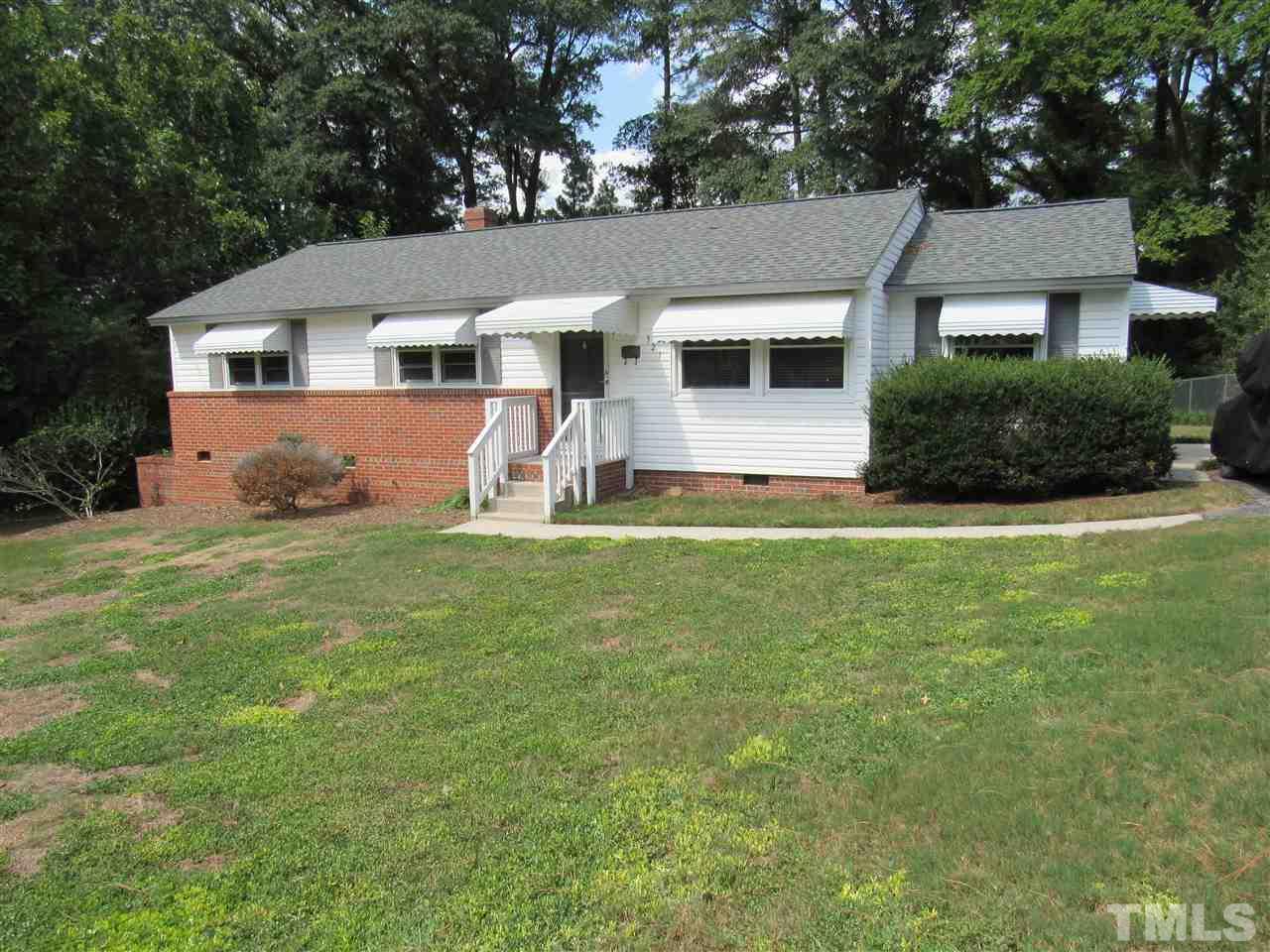 321 Quail Drive Raleigh, NC 27604 - Photo 1 of 25 a front view of a house with a yard and garage
