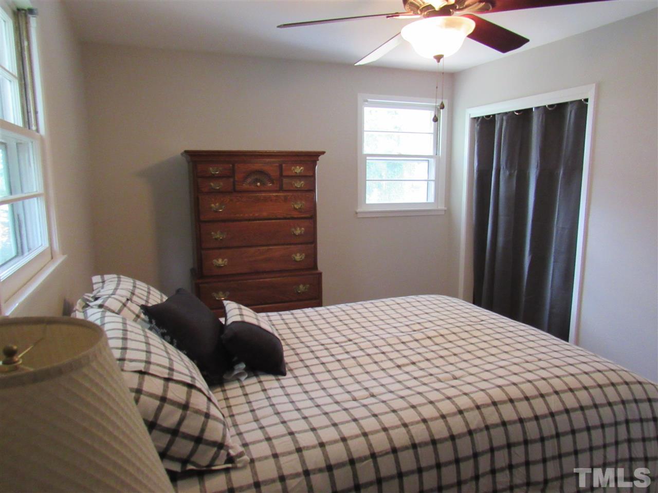 321 Quail Drive Raleigh, NC 27604 - Photo 11 of 25 a bedroom with a bed and window