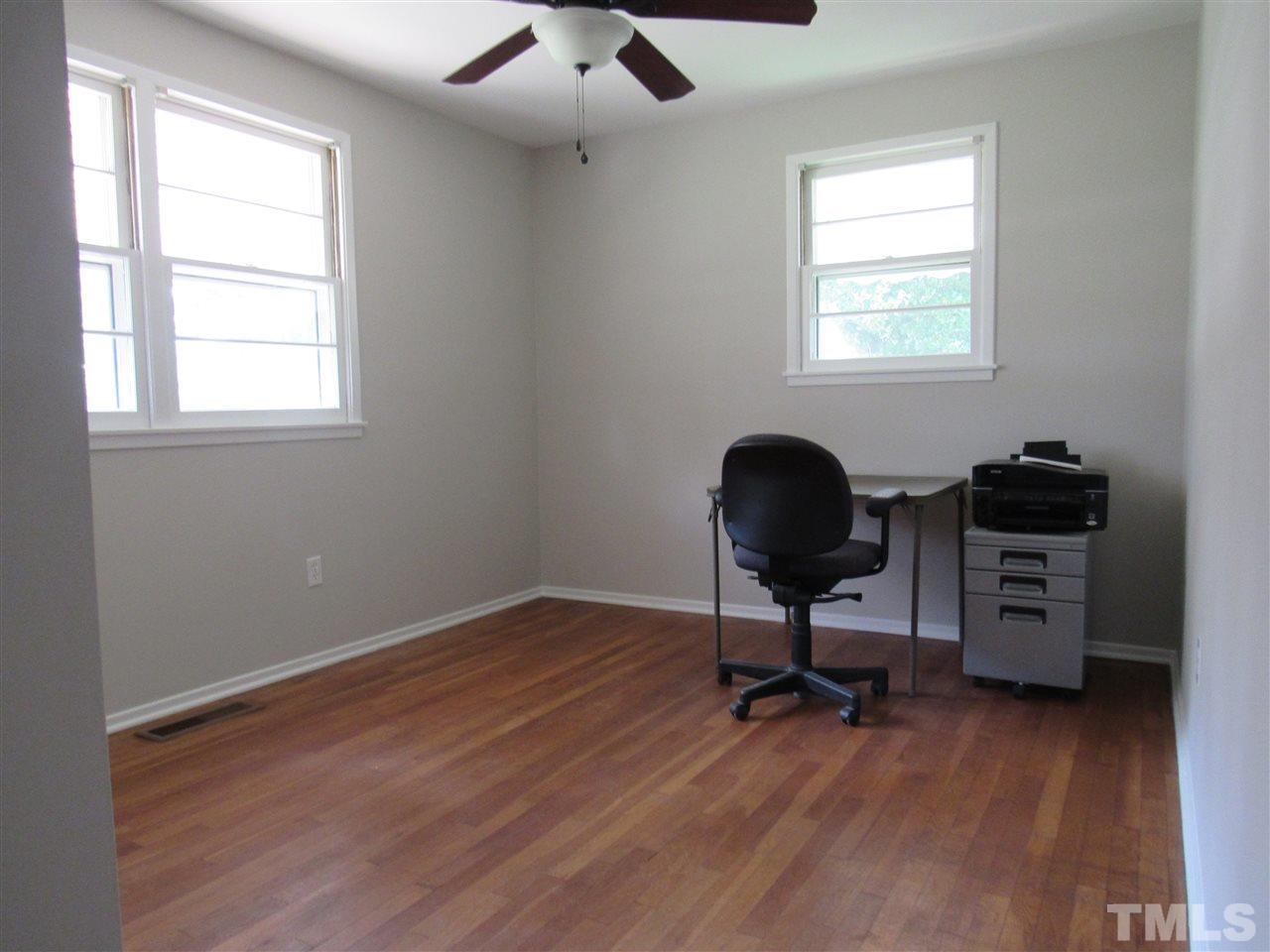 321 Quail Drive Raleigh, NC 27604 - Photo 13 of 25 a view of a workspace with furniture and a window
