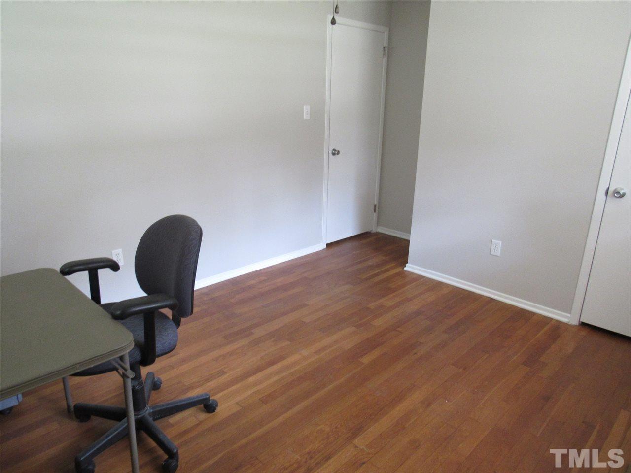 321 Quail Drive Raleigh, NC 27604 - Photo 14 of 25 a view of a workspace room with wooden floor space
